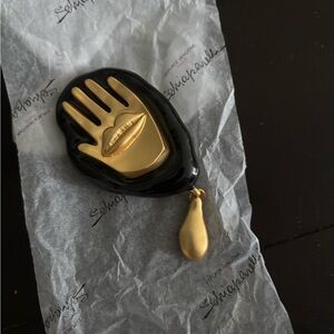 Famous Schiaparelli gold and Black enamel Hand-Shaped Brooch